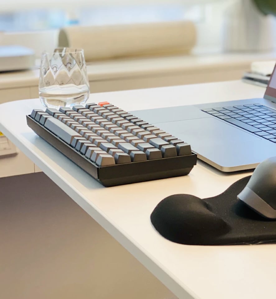 keyboard with glass on a table