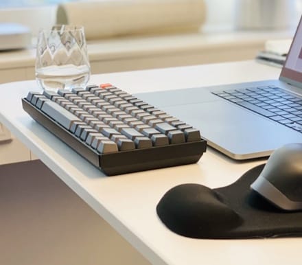 keyboard with glass on a table 